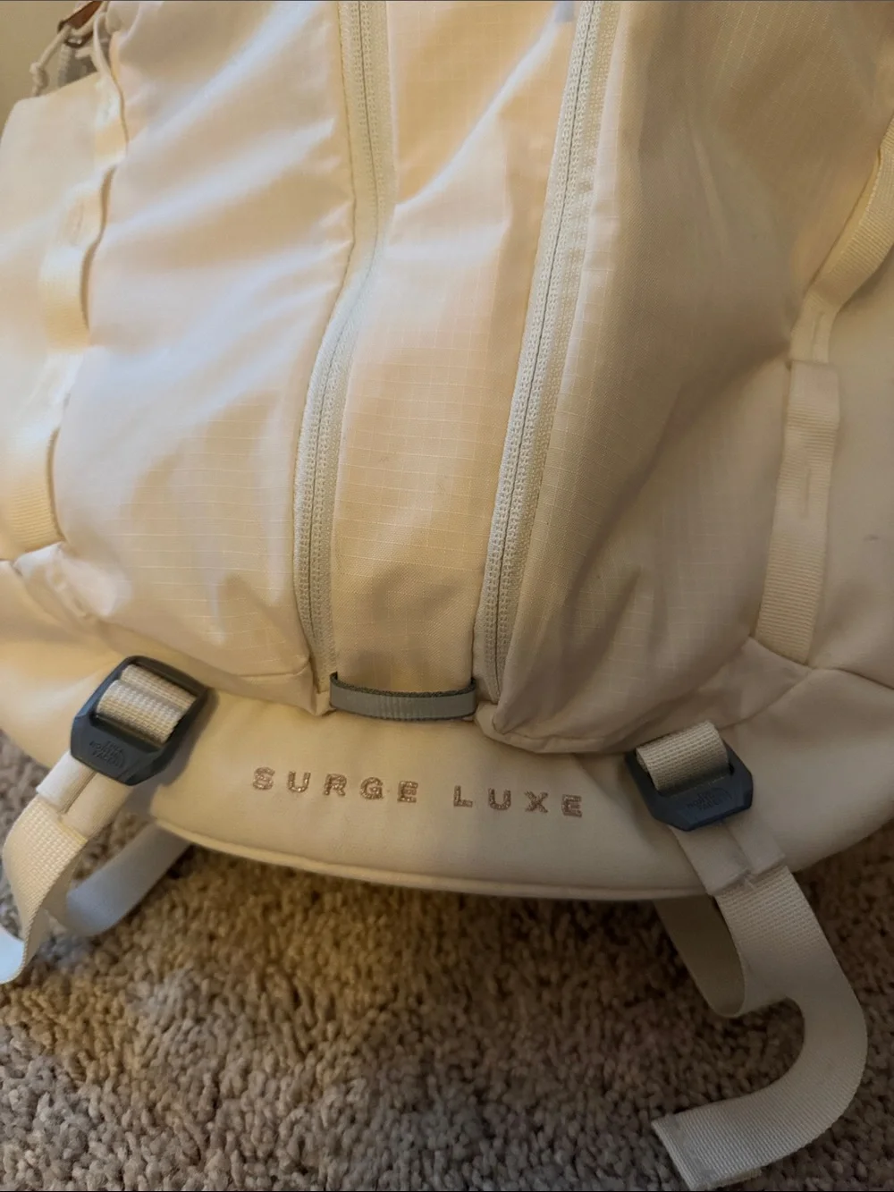 The North Face Surge Lux Backpack in Cream with Rose Gold(good as new 90%)